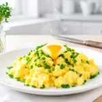 fluffy scrambled eggs with chive butter - featured image