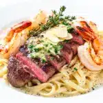 garlic butter steak and shrimp pasta - featured image